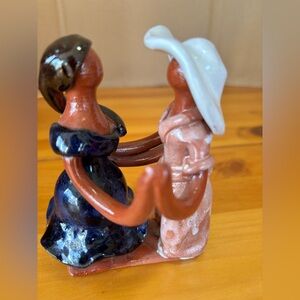 Collectible folk art figurine- couple dancing in traditional attire.